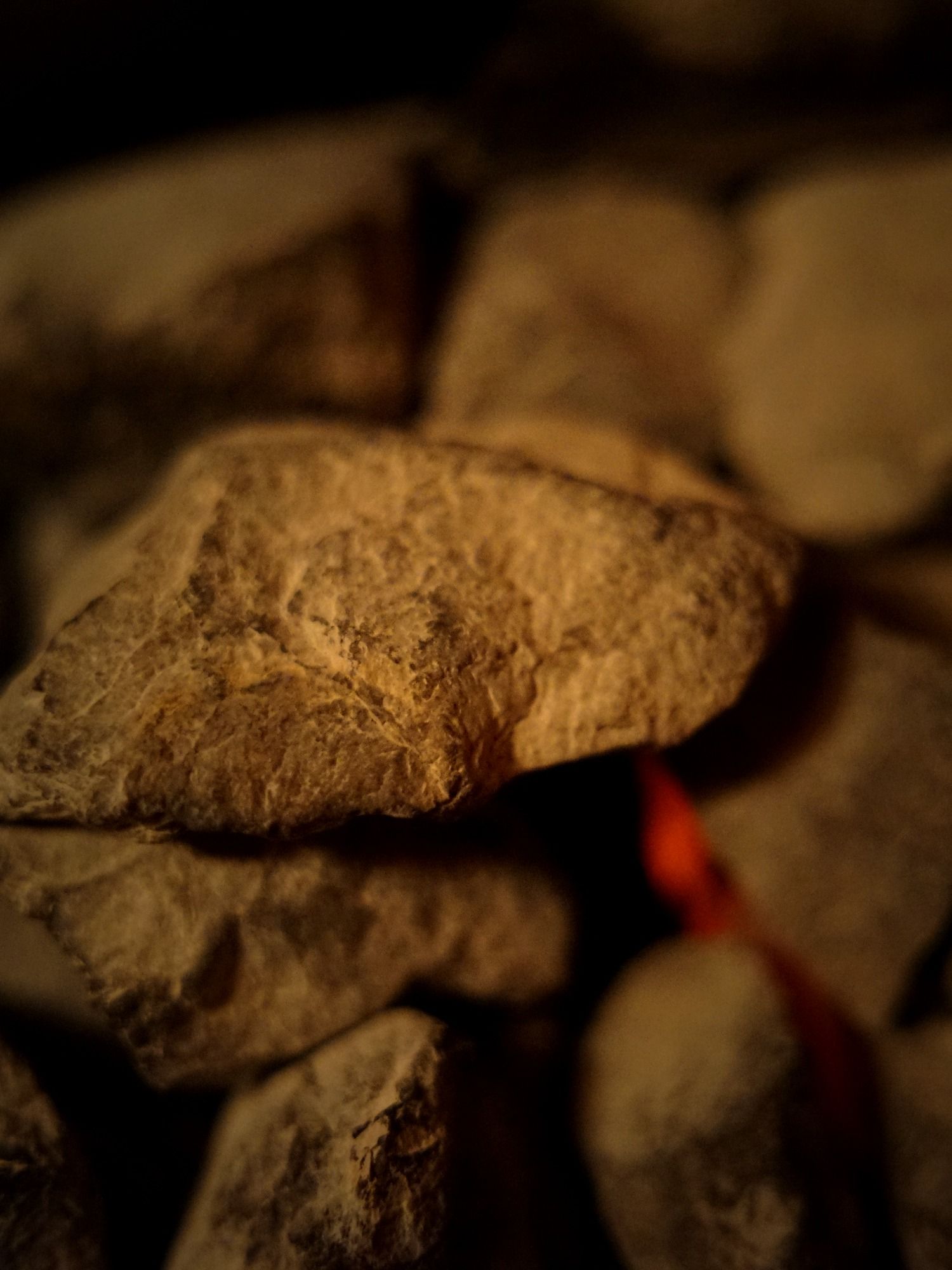 Sauna stones glowing in darkness