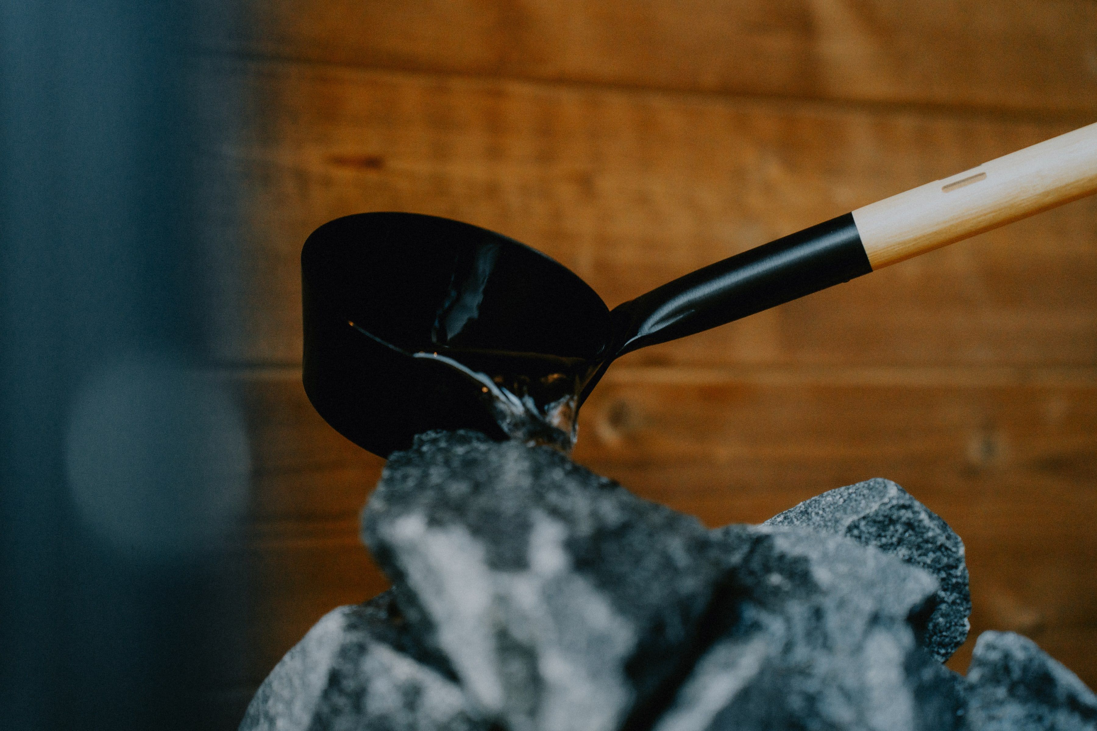 Water being poured onto heated sauna stones — the löyly moment